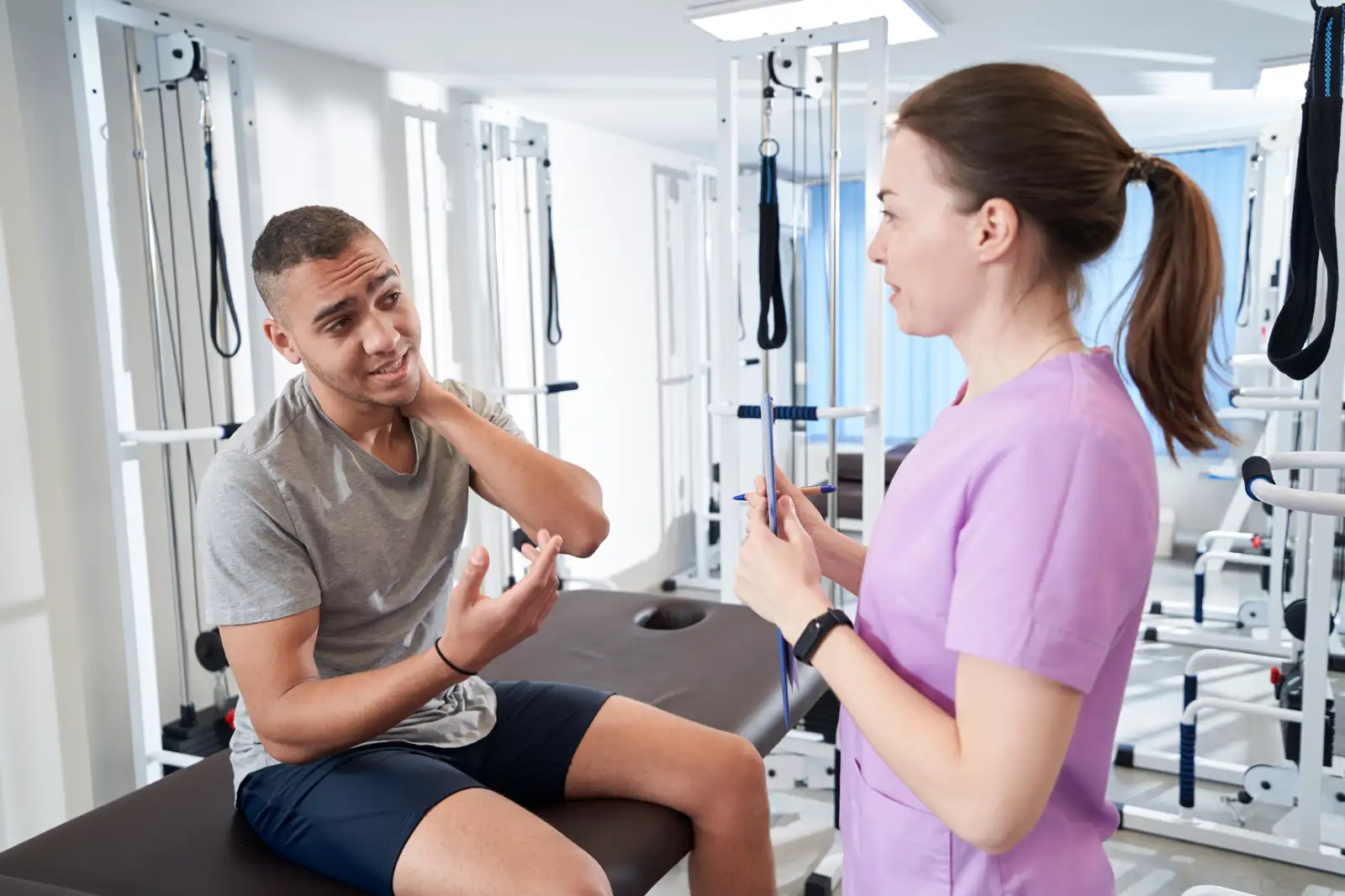 Two clinicians talking through a case
